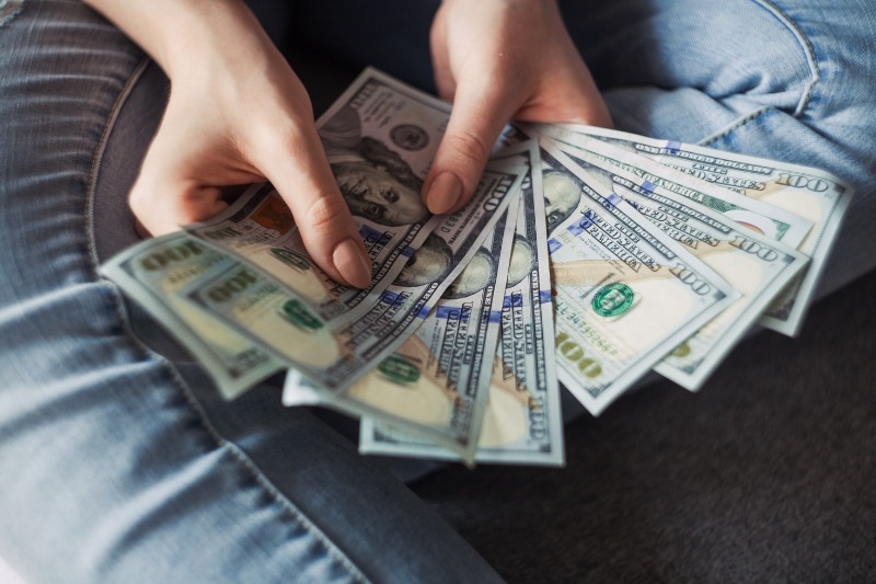 girl holding a money